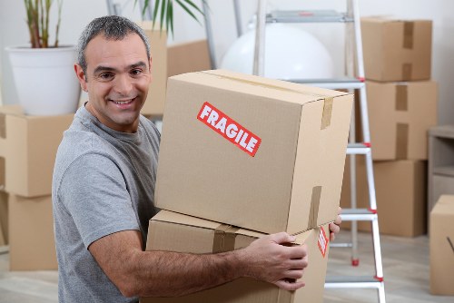 Local team loading office furniture during a Cowley commercial clear-out
