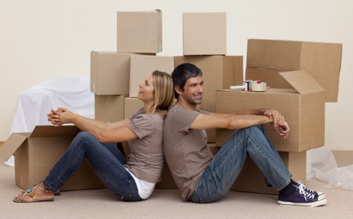 Boxes and furniture being loaded for a quote-based van move