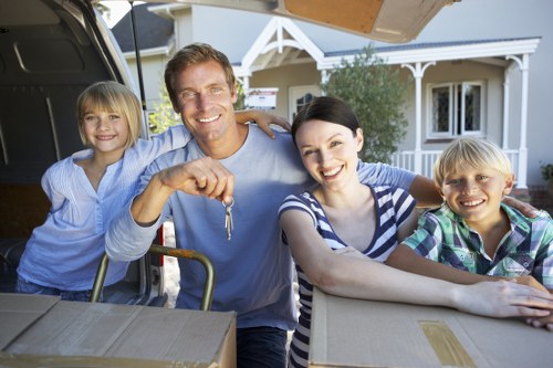 Local moving team handling boxes in a Cowley residential property