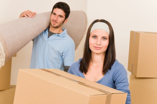 Professional movers loading household items for a Cowley move