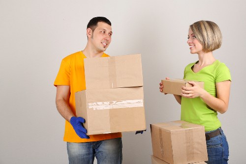 Removal team handling furniture and boxes during a Cowley house move