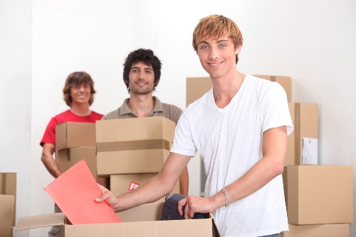 Packed business items and removal boxes ready for transport in Cowley